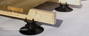 An image showing how decking pedestals can be used to help avoid standing water