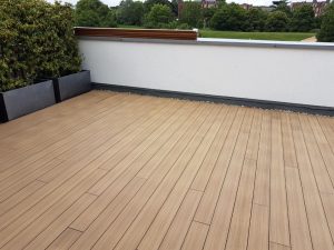 An image of a completed deck installation using teak decking tiles