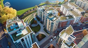 An image of a number of green roofs on top of high rise buildings